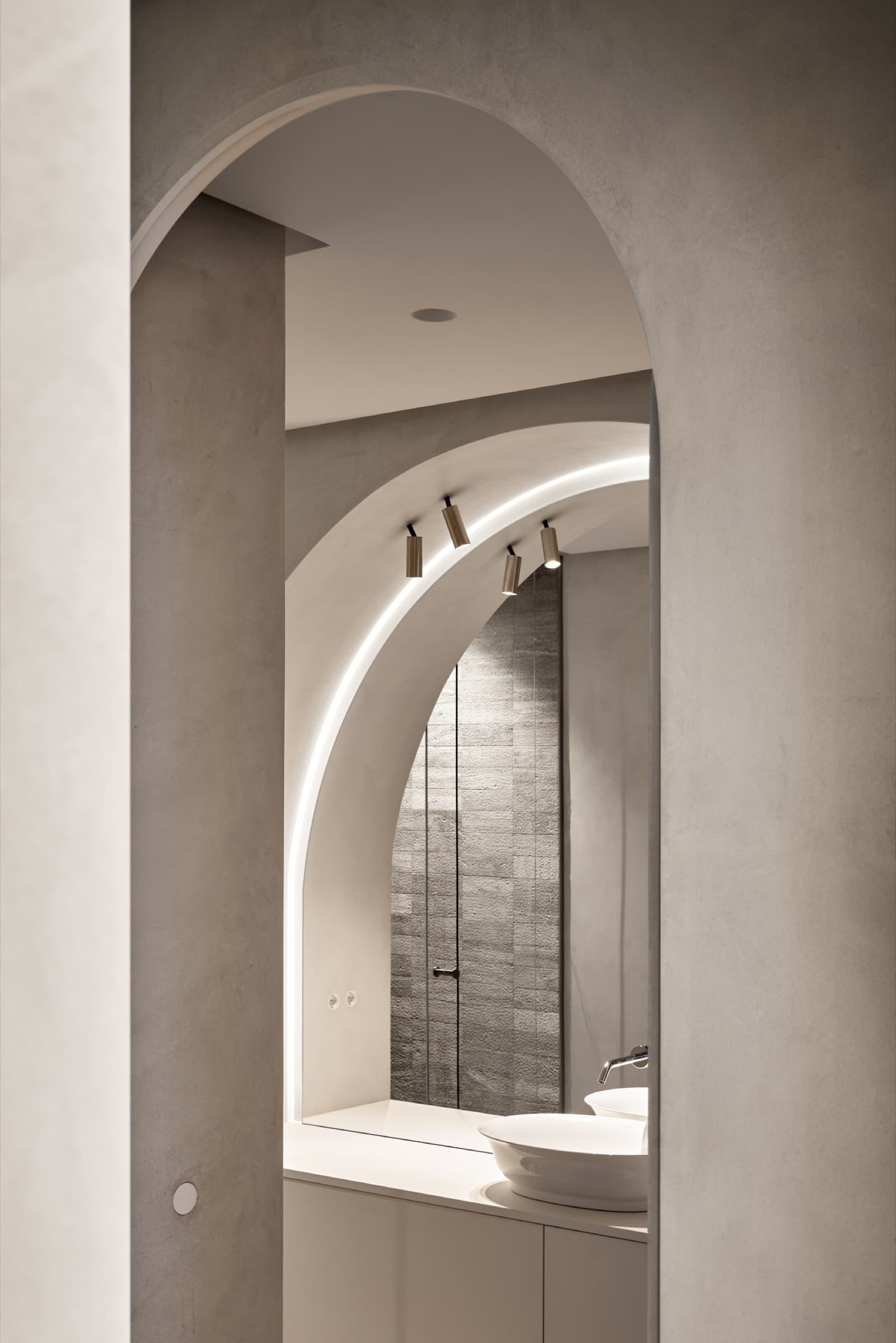 Arched plaster doorway with warm lighting
